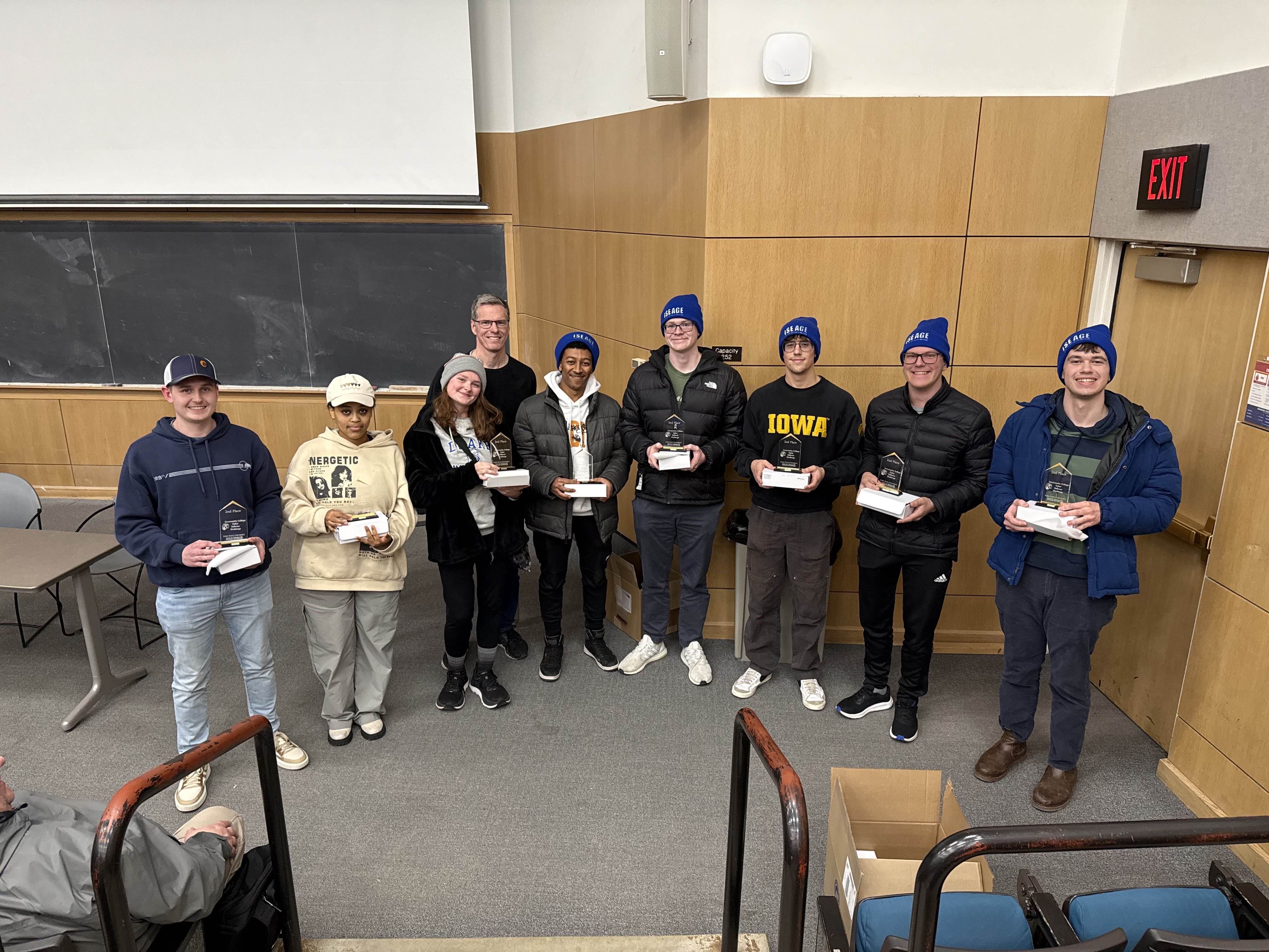 Drake University team holding 2nd place trophy at C3 2025 Cyber Defense Competition